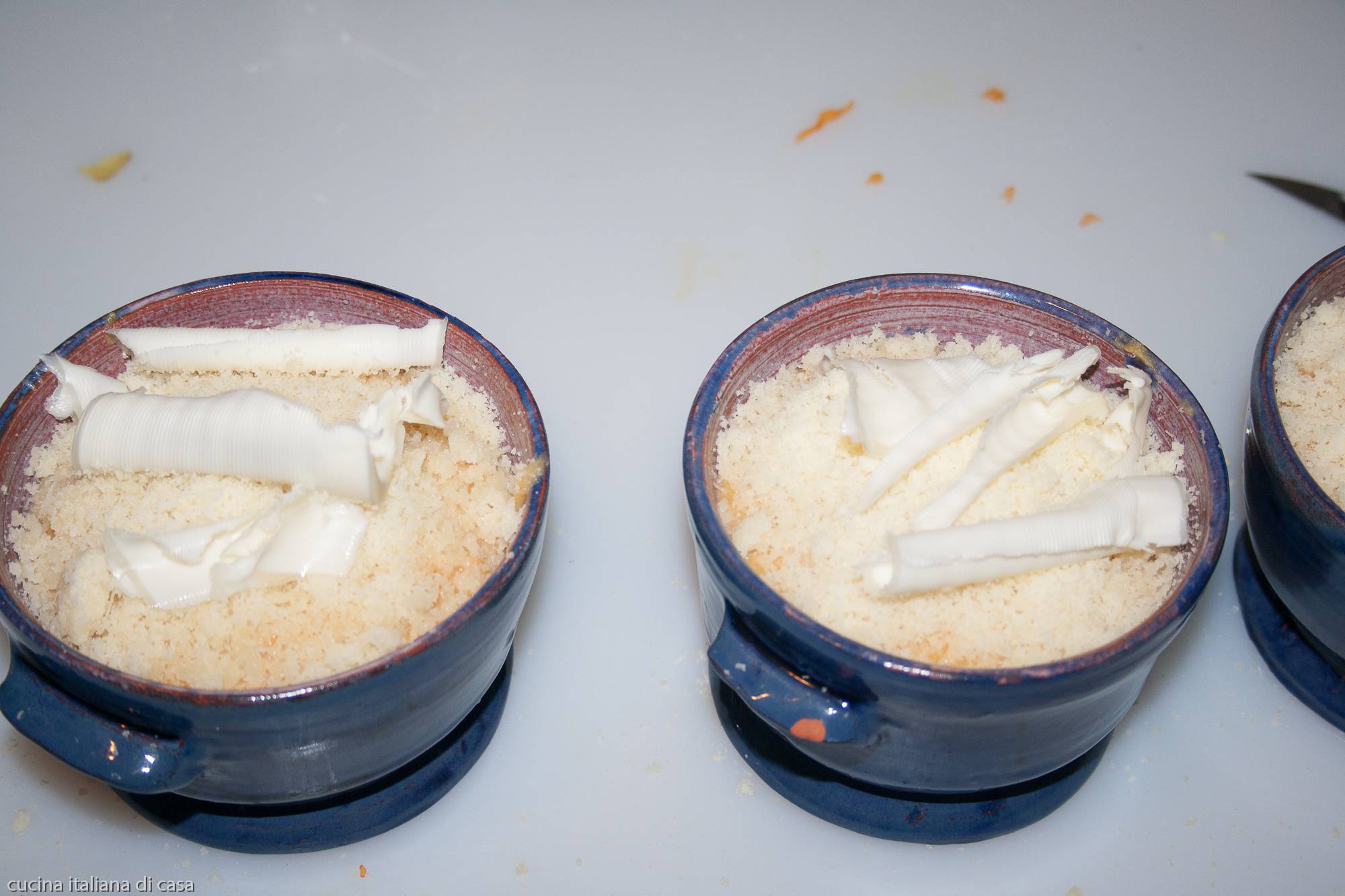 burro su formaggio grattuggiato