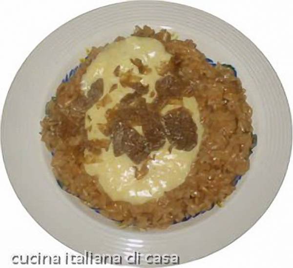 Risotto al tartufo nero con fonduta di parmigiano, ricetta raffinata